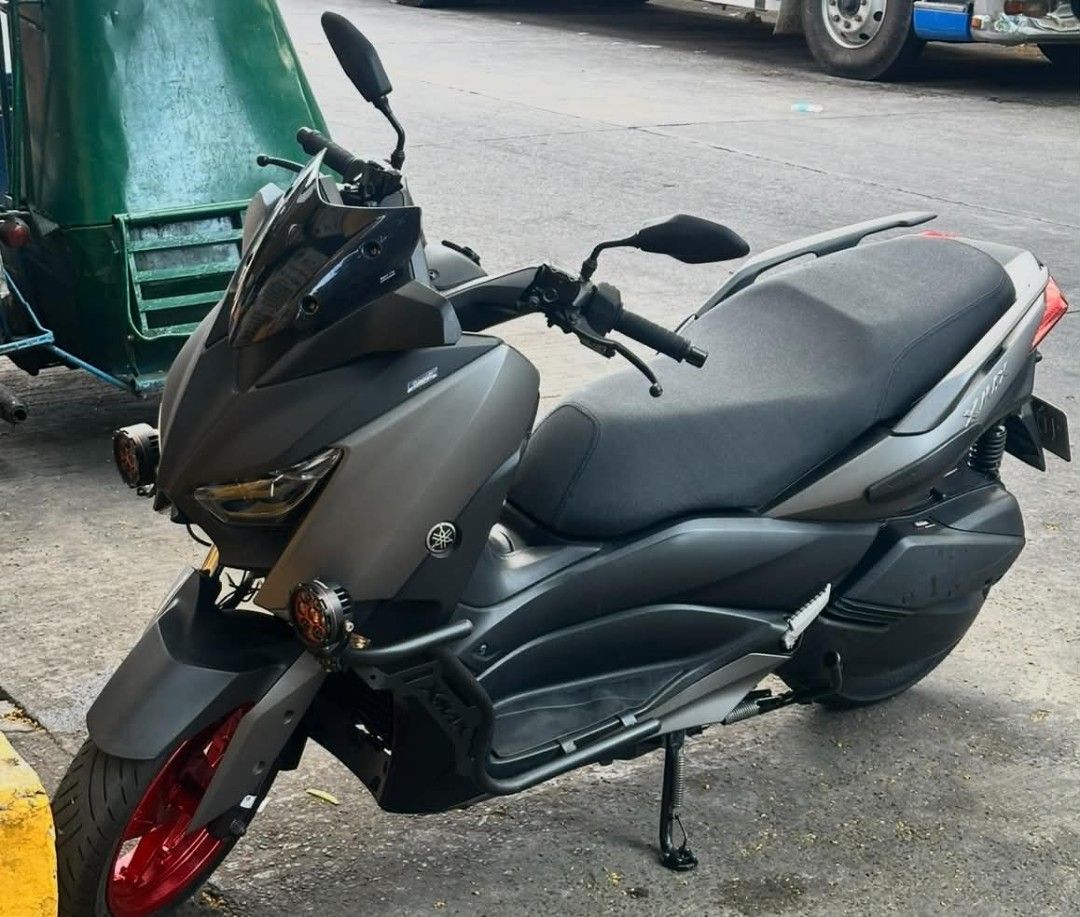 Yamaha XMAX V1 (Category: Motorbikes for Sale) located in Manila. Submitted by harvey_specter2301 (Listing ID 1463231343, Image 1). Description: Yamaha XMAX V1 2018 16,XXX ODO Complete Original Documents Spare Remote With Red Code Eurogrip Bee Oversize Tires Driving Lights Crashguard Registered Til August 2027 Under my name Note: - Cat Scratches sa seat - Missing 2 bolts *No engine/mechanical issues Strictly for pickup only parked infront of bara