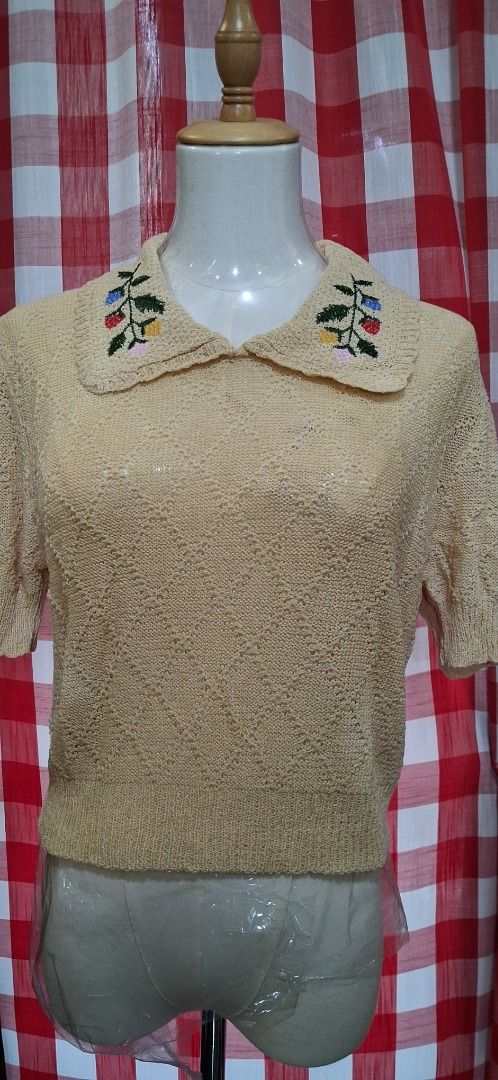 Yellow Embroidered Collar Knit Top (Category: Blouses) located in Manila. Submitted by katkween23 (Listing ID 1463221448, Image 2). Description: - Adorable yellow knit top - Features a pretty embroidered collar with colorful flowers - Short sleeves - Unique diamond knit pattern - Versatile: pairs well with jeans or skirts - Ideal for casual outings or a vintage-inspired style.