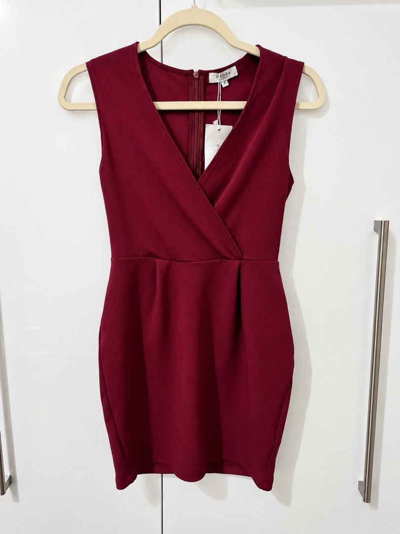 Zalora Red Wrap Dress (Category: Dresses) located in Manila. Submitted by goodthingspreloved.92 (Listing ID 1461014097, Image 2). Description: - Burgundy dress from Zalora - Sleeveless with V-neckline - with Tag.
