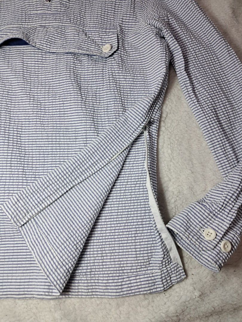 Zara anorak windbreaker jacket (Category: Coats, Jackets and Outerwear) located in Baguio. Submitted by mishmashfritz (Listing ID 1463196991, Image 3). Description: xs to s unisex, see dimes for reference,1 side zipper, adjustable hood, nylon lining sa hood, Blue and white striped seersucker fabric featuring puckered vertical stripes..
