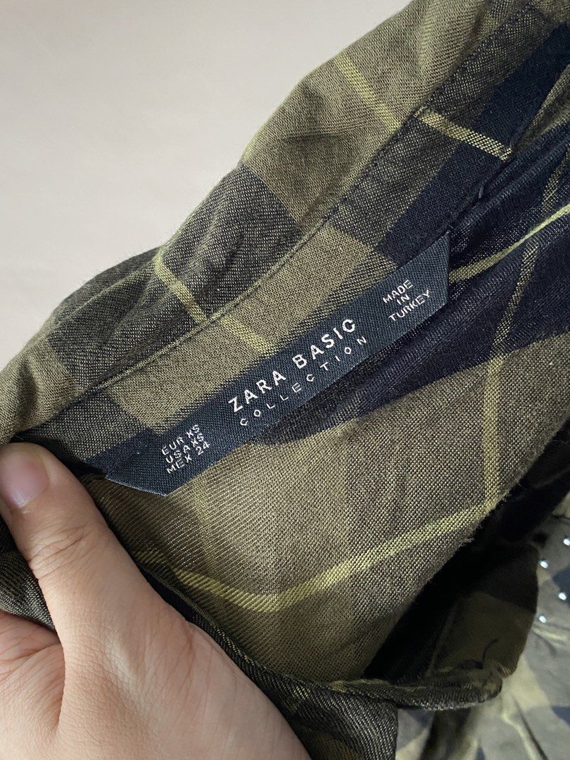 Zara Basic Collection Plaid Shirt with Studs (Category: Shirts) located in Makati City. Submitted by dcltering_unicorn (Listing ID 1463129493, Image 2). Description: ♡ 𝙖𝙗𝙤𝙪𝙩 𝙩𝙝𝙚 𝙞𝙩𝙚𝙢 ♡ ✿ brand: Zara Basic Collection ✿ size: XS (length: 23 in ; width: 18 in) ✿ color: army green and black ✿ style: plaid shirt with long sleeves with button cuffs, two chest pockets with stud detailing ✿ price is negotiable, you can send me a pm ✿ rfs: dec