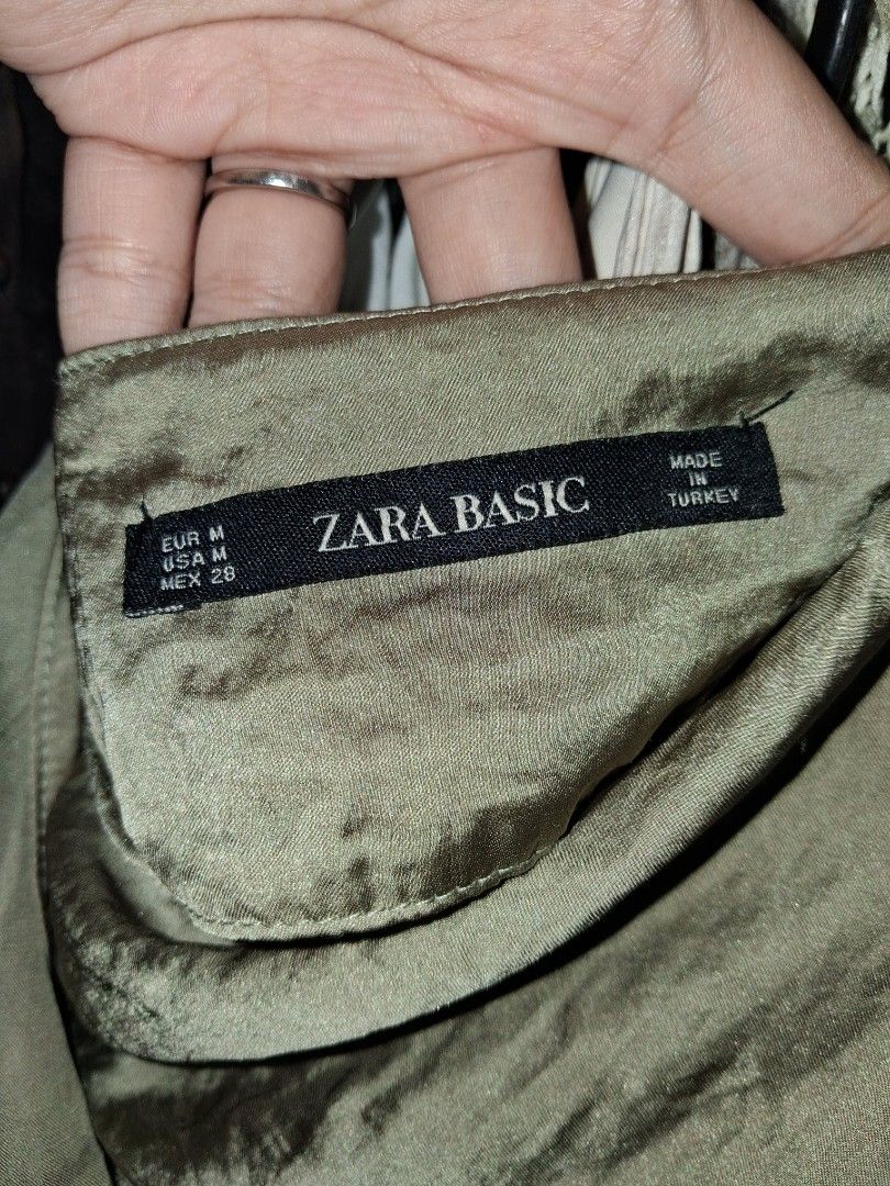 Zara Basic Satin Cowl Neck Ruched Midi Dress (Category: Dresses) located in Quezon City. Submitted by patriciam.02 (Listing ID 1463213344, Image 2). Description: Olive green satin midi dress from Zara Basic. Features a cowl neckline and ruched detailing on the side. Adjustable spaghetti straps. Midi length. Made in Turkey. Great for a night out or a special occasion. Once lang nagamit🫶🏻.