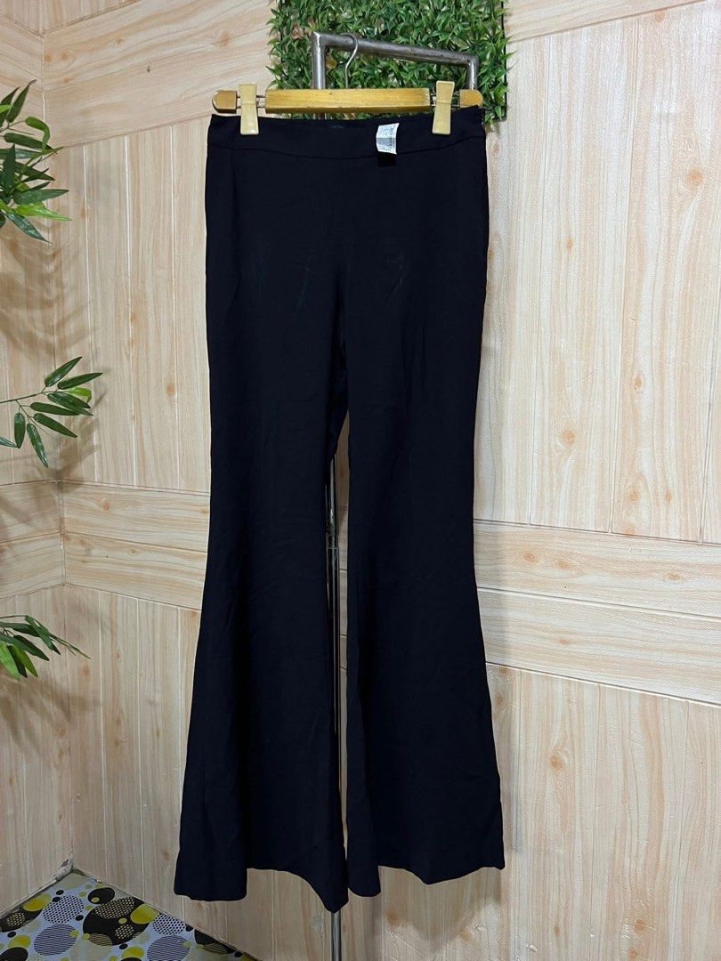 ZARA Black Flared Trousers Pants (Category: Other Bottoms) located in Pasay City. Submitted by cheesca17 (Listing ID 1463283016, Image 1). Description: - Zara Black Flared Trousers - High-waisted style - Made in Morocco - Size S - Comfortable fit - Perfect for dressing up or down.