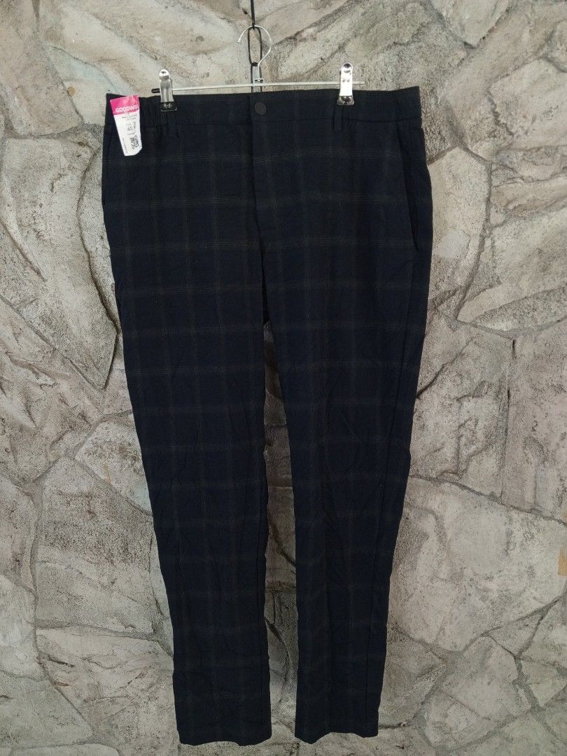 ZARA Dark Blue Plaid Pants (Category: Other Bottoms) located in Orani. Submitted by thriftniea (Listing ID 1463202700, Image 1). Description: W34-36 L38 H6 - Dark blue pants with a subtle plaid pattern - Classic fit, suitable for casual or smart casual occasions - Front button and zip closure - Two functional pockets at the back - Comfortable cotton blend material - A versatile staple piece for any wardrobe.