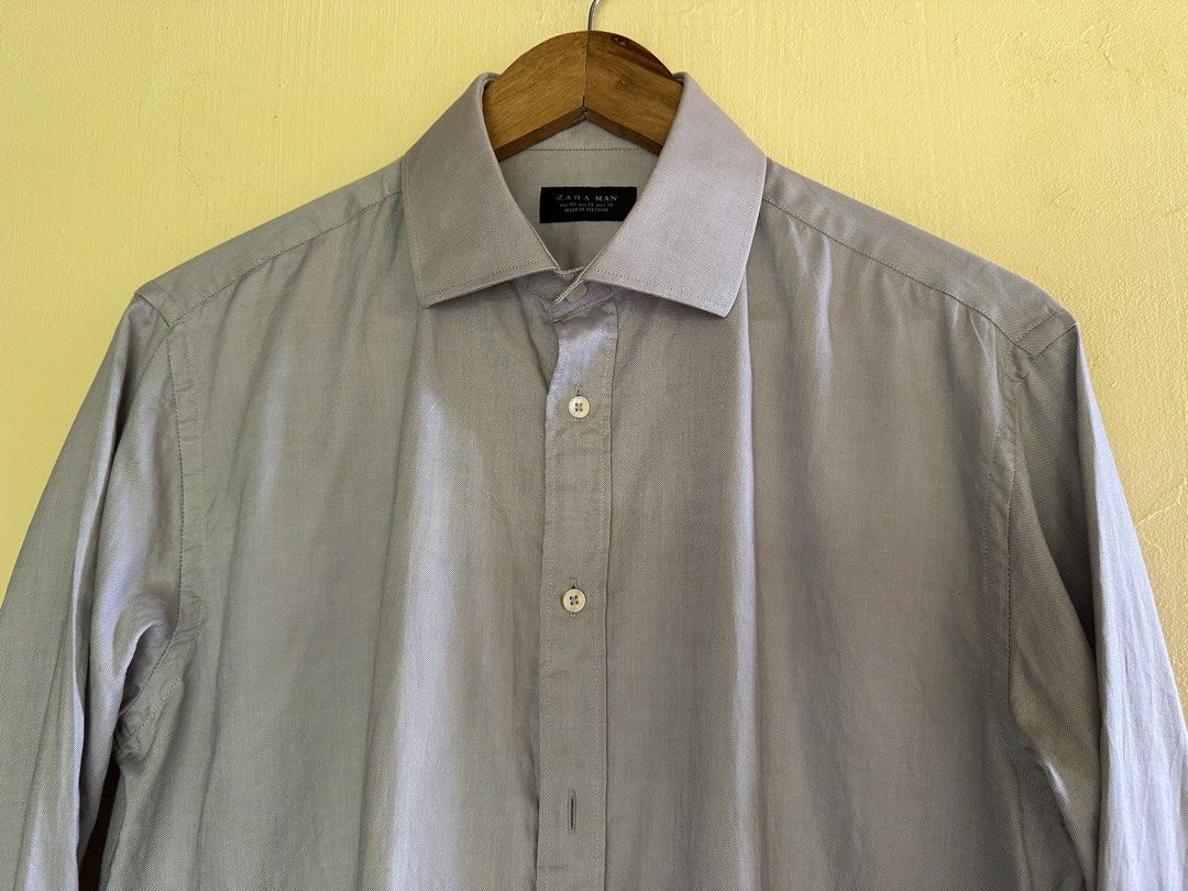 Zara Man Grey Long Sleeve Button Up Shirt (Category: Tshirts & Polo Shirts ) located in Calapan. Submitted by shakalak (Listing ID 1463174810, Image 3). Description: - Zara Man Grey Long Sleeve Shirt - Button-up front with classic collar - Min signs of used sa inner collar -21x27-29 - Ideal for smart casual or work attire - Please check photos for detailed condition.