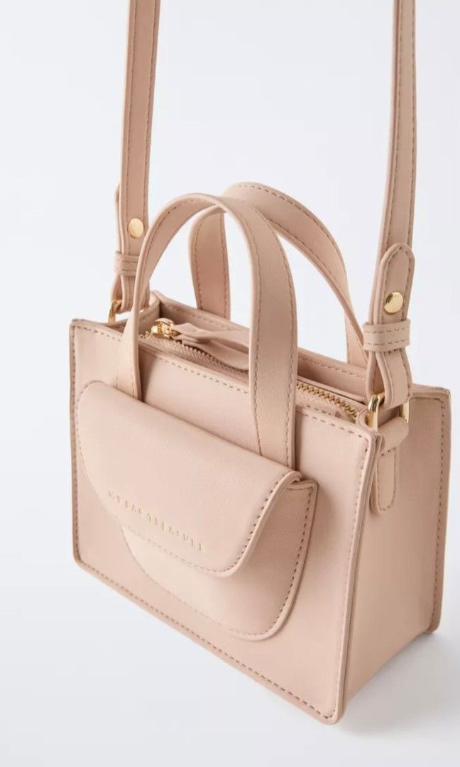 Zara mini crossbody bag (Category: Cross-body Bags) located in Manila. Submitted by mommynurse (Listing ID 1463129430, Image 2). Description: Neutral crossbody bag Zip closure Front zip pocket Shoulder strap Height x Length x Width 12 x 17 x 7 cm. / 4.7 x 6.6 x 2.7″ ( 1st and 2nd photo for reference only ).