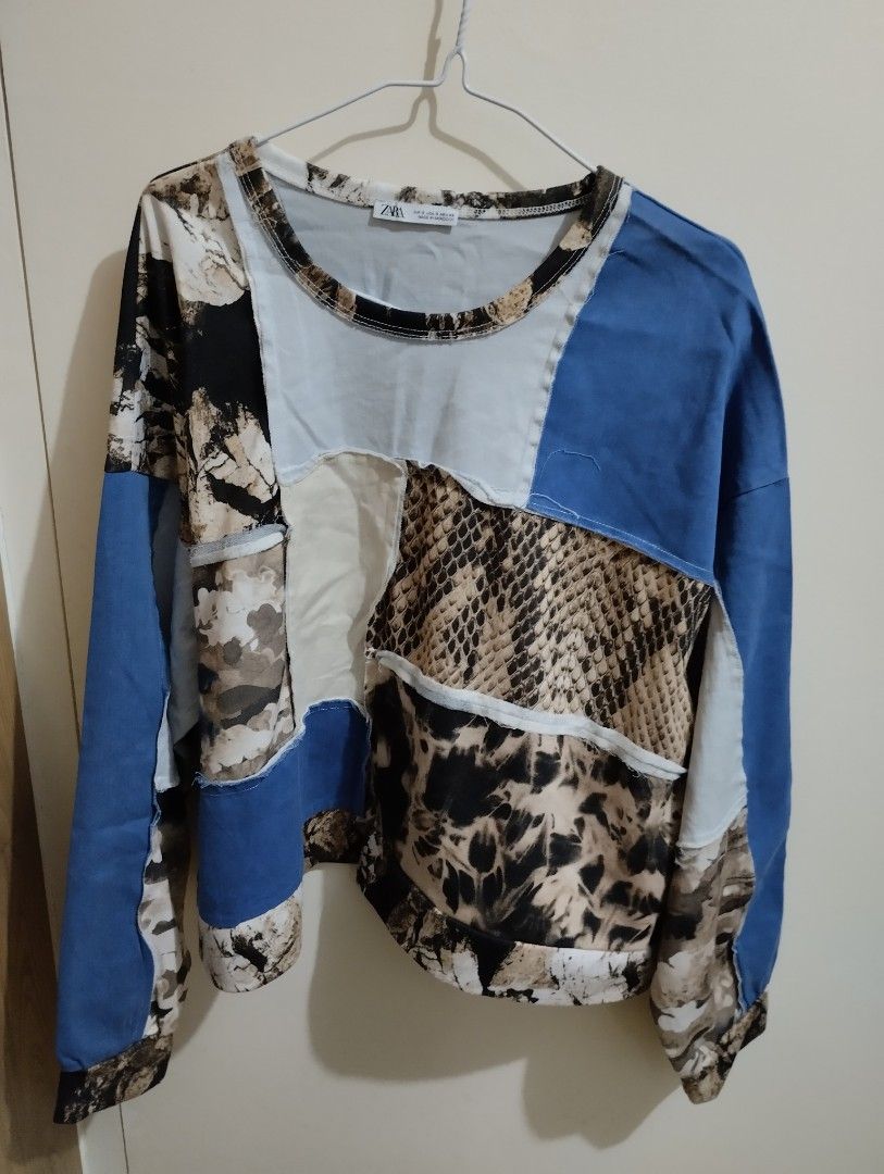 Zara Patchwork Print Sweatshirt (Category: Longsleeves) located in Mabalacat. Submitted by uniqlover (Listing ID 1463271814, Image 1). Description: - Zara patchwork sweatshirt - Size S - Unique mix of prints and blue denim-like panels - Long sleeves, crew neck - Made in Morocco.