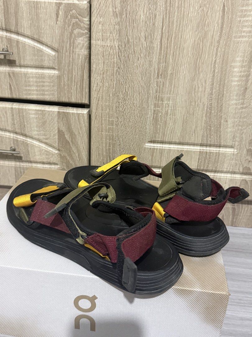 Zara sandals (Category: Slippers & Slides) located in Manila. Submitted by marlboxspace (Listing ID 1463303488, Image 1). Description: - Comfortable and sporty design - Black base with maroon, olive green, and yellow strap accents - Adjustable velcro closures for a secure fit - Perfect for casual outings or outdoor adventures - Easy slip-on and slip-off convenience Used few times only.