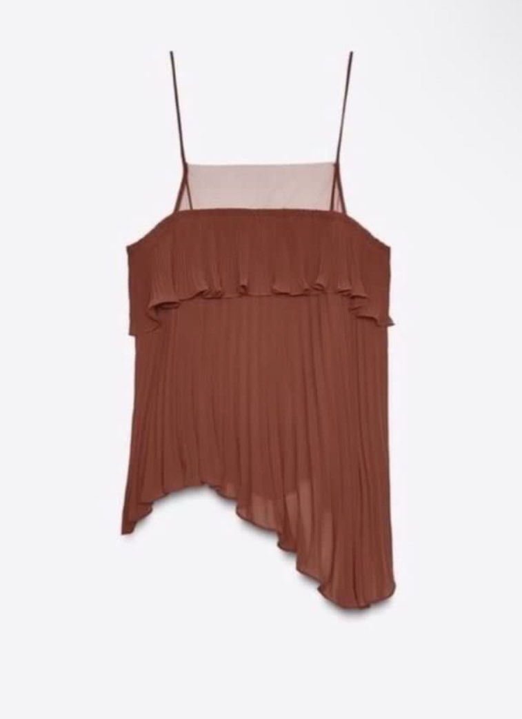 Zara top (Category: Others Tops) located in Valenzuela. Submitted by kissmuna (Listing ID 1463210465, Image 1). Description: - Elegant brown camisole top - All-over pleating for texture - Ruffled detail across the bust - Unique asymmetrical hemline - Delicate spaghetti straps - Sheer panel at the neckline for a subtle touch.