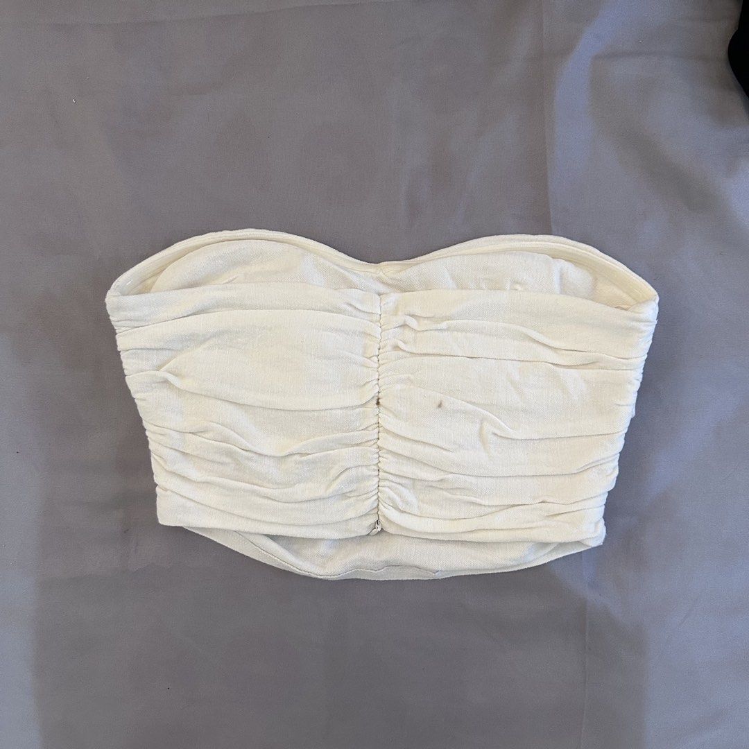 Zara White Tube Top (Category: Sleeveless) located in Cabuyao City. Submitted by hyugaclan (Listing ID 1463133340, Image 2). Description: Small washable stain on the back.