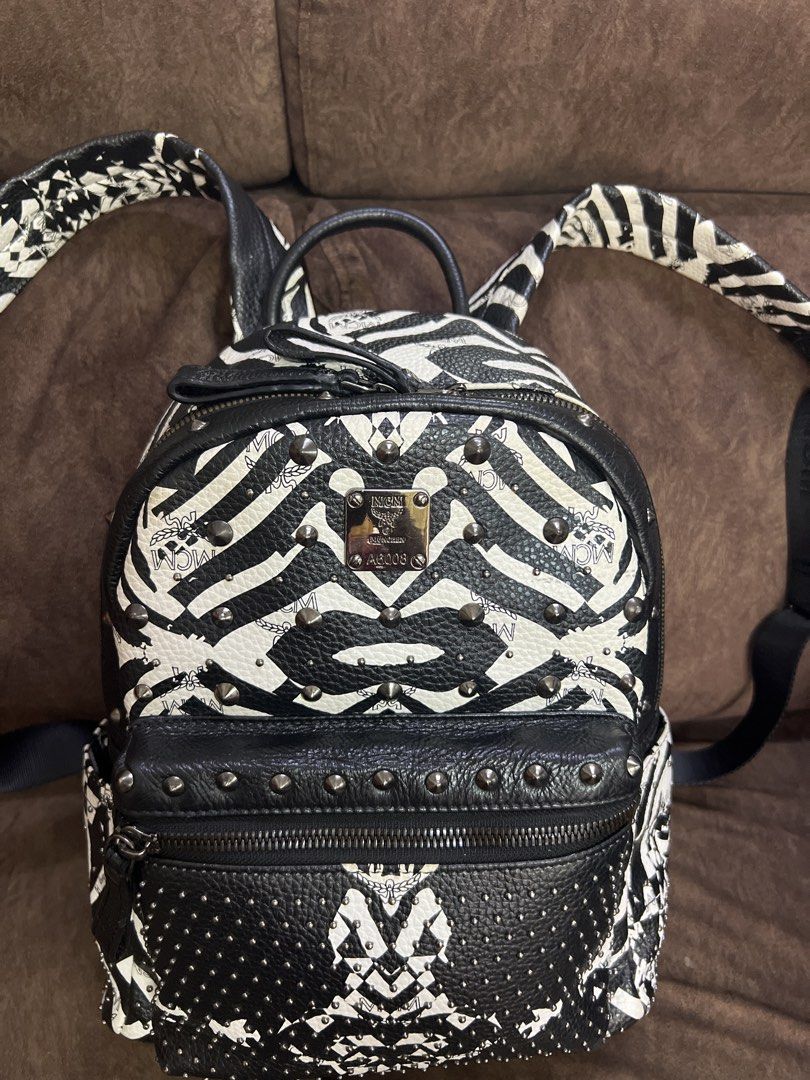 Zebra Print Backpack (Category: Backpacks) located in Kuala Lumpur. Submitted by bels888 (Listing ID 1463151721, Image 2). Description: - Made in korea - Features stylish stud detailing. - Includes a convenient front zip pocket and a spacious main compartment. - Adjustable straps for a comfortable fit. - Interior lined with MCM logo fabric. - Ideal for everyday wear or as a standout fashion accessory..