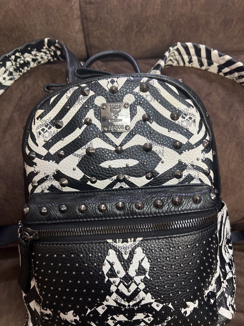 Zebra Print Backpack (Category: Backpacks) located in Kuala Lumpur. Submitted by bels888 (Listing ID 1463151721, Image 3). Description: - Made in korea - Features stylish stud detailing. - Includes a convenient front zip pocket and a spacious main compartment. - Adjustable straps for a comfortable fit. - Interior lined with MCM logo fabric. - Ideal for everyday wear or as a standout fashion accessory..