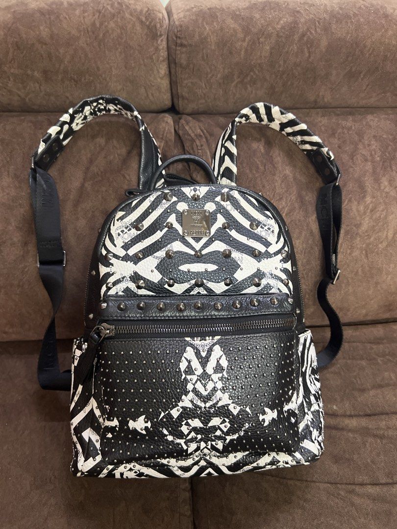 Zebra Print Backpack (Category: Backpacks) located in Kuala Lumpur. Submitted by bels888 (Listing ID 1463151721, Image 1). Description: - Made in korea - Features stylish stud detailing. - Includes a convenient front zip pocket and a spacious main compartment. - Adjustable straps for a comfortable fit. - Interior lined with MCM logo fabric. - Ideal for everyday wear or as a standout fashion accessory..