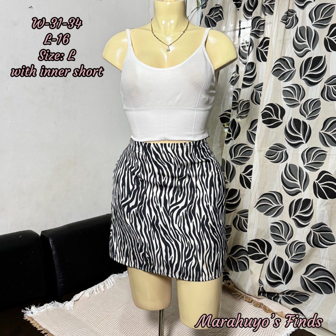 Zebra Print Mini Skirt with White Crop Top Set (Category: Sets or Coordinates) located in Mabalacat. Submitted by marahuyos.finds (Listing ID 1463232117, Image 1). Description: - Adorable zebra print mini skirt - Includes a white ribbed crop top - Skirt features an inner short for added comfort - Versatile for casual day or night looks - Pairs well with sneakers or heels.