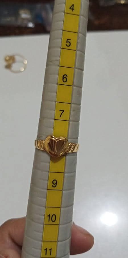 18k Light weight Gold ring (Category: Other Accessories) located in Teresa. Submitted by lovedbykels (Listing ID 1463347035, Image 1). Description: Bought from Ms. Riza Laquio (Owner of Happy Gold on Facebook) - Due to usage it's not a perfectly circled ring anymore - size 8.