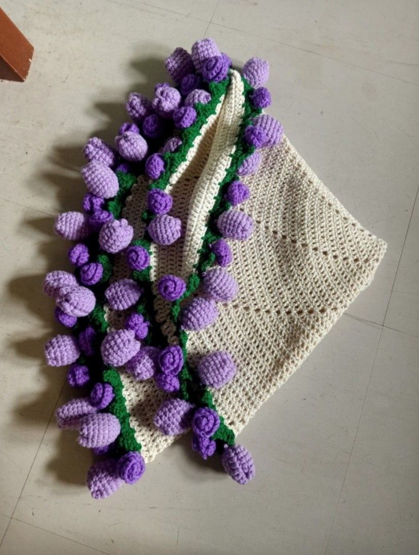 30cm Crochet blanket boquet (Category: Other Accessories) located in Baguio. Submitted by vyner_hues (Listing ID 1463406636, Image 2). Description: - Beautiful handmade crocheted blanket or shawl. - Intricate crochet work with decorative pom-pom edging. - Available in cream with blue, purple, or yellow pom-poms. - Adds a cozy touch to your home or as a stylish accessory. - Each piece is unique and crafted with care. - Great for gifting!.