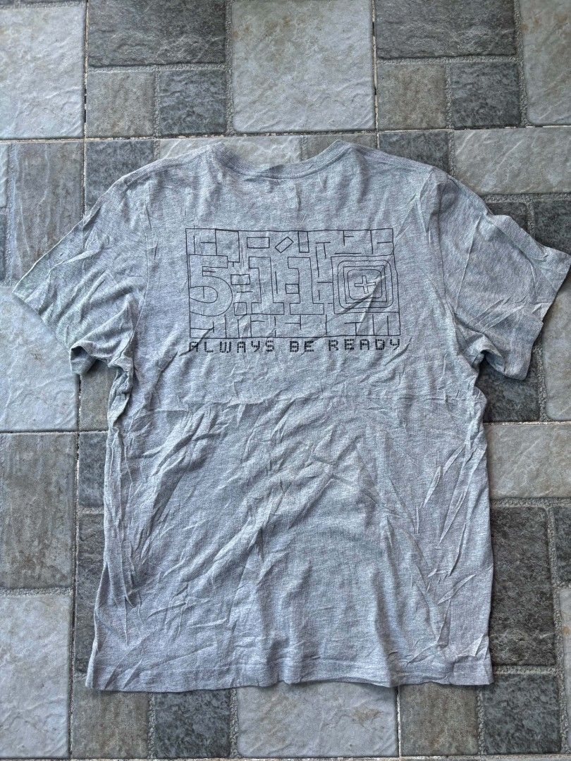 5.11 Tactical T-Shirt Grey "Always Be Ready" (Category: Tshirts & Polo Shirts ) located in Iriga City. Submitted by thrifttobicol29 (Listing ID 1463449712, Image 2). Description: - Grey 5.11 Tactical T-Shirt - Size: Small - 'Always Be Ready' slogan with graphic on the back - Small 5.11 logo on the front chest - Comfortable for everyday wear - Suitable for casual outings or training - 511 Medium W 21" L 28" Excellent condition Issue: Unnoticeable 