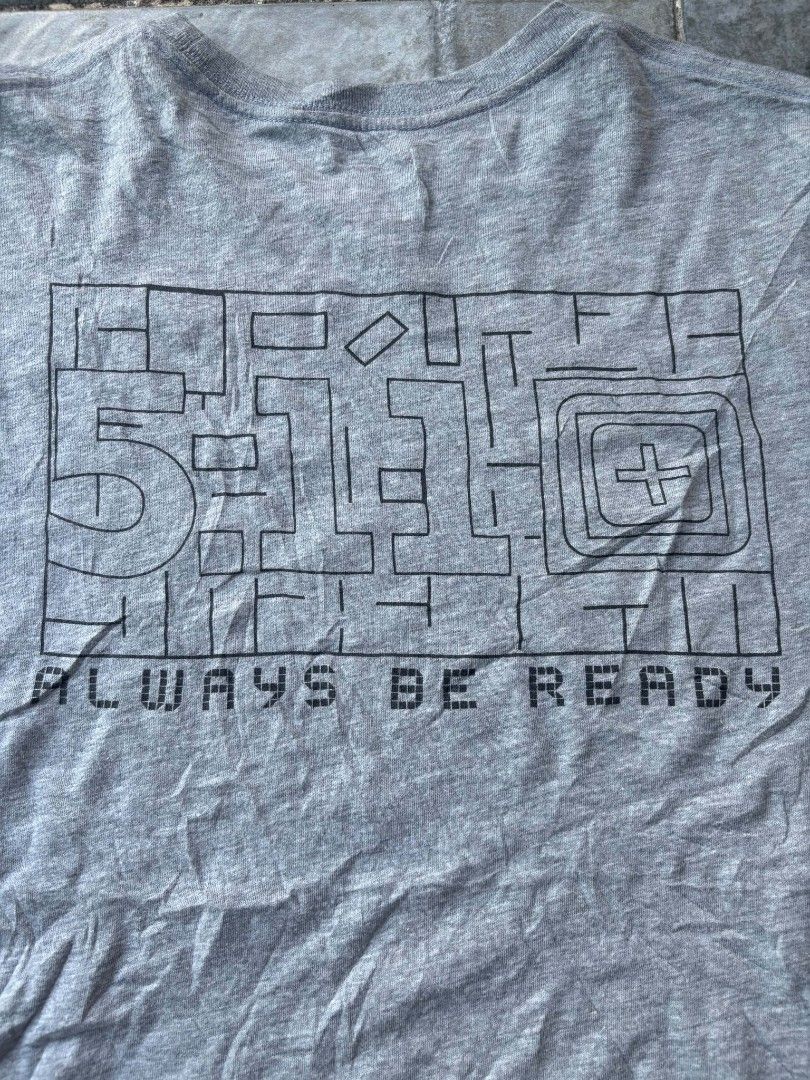 5.11 Tactical T-Shirt Grey "Always Be Ready" (Category: Tshirts & Polo Shirts ) located in Iriga City. Submitted by thrifttobicol29 (Listing ID 1463449712, Image 3). Description: - Grey 5.11 Tactical T-Shirt - Size: Small - 'Always Be Ready' slogan with graphic on the back - Small 5.11 logo on the front chest - Comfortable for everyday wear - Suitable for casual outings or training - 511 Medium W 21" L 28" Excellent condition Issue: Unnoticeable 