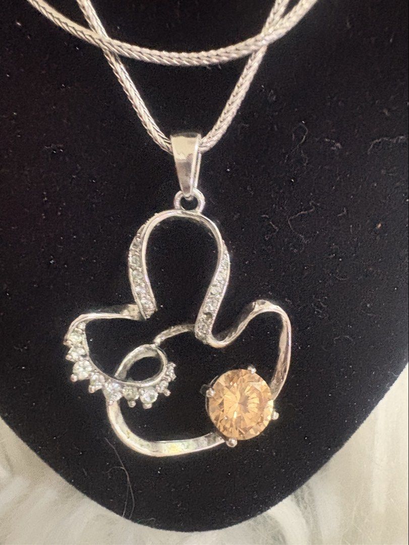 925 Sterling Silver Mickey Mouse pendant with Stones (Category: Necklaces) located in Iligan City. Submitted by sampascan229943 (Listing ID 1463486087, Image 2). Description: - Cute Mickey Mouse inspired pendant necklace - Made of genuine 925 sterling silver - Adorned with sparkling clear and champagne colored stones - Includes a sterling silver chain with a secure clasp - Ideal gift for Disney fans and jewelry enthusiasts.