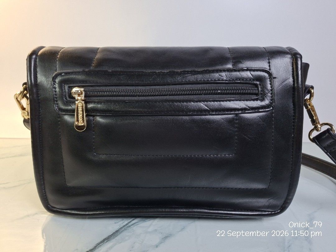 ✨ Chic & Timeless FIRANO Leather Flap Bag ✨ (Category: Shoulder Bags) located in Pasay City. Submitted by onick_79 (Listing ID 1463509882, Image 2). Description: * 🏷️ Brand: FIRANO * 🖤 Material: Premium Genuine Leather with luxe gold-tone hardware * 📐 Dimensions: L 26 cm x H 18 cm x W 10 cm * 👜 Style & Design: Quilted flap front with magnetic closures and an adjustable crossbody strap * 🎒 Storage: Spacious lined main compartment with interio