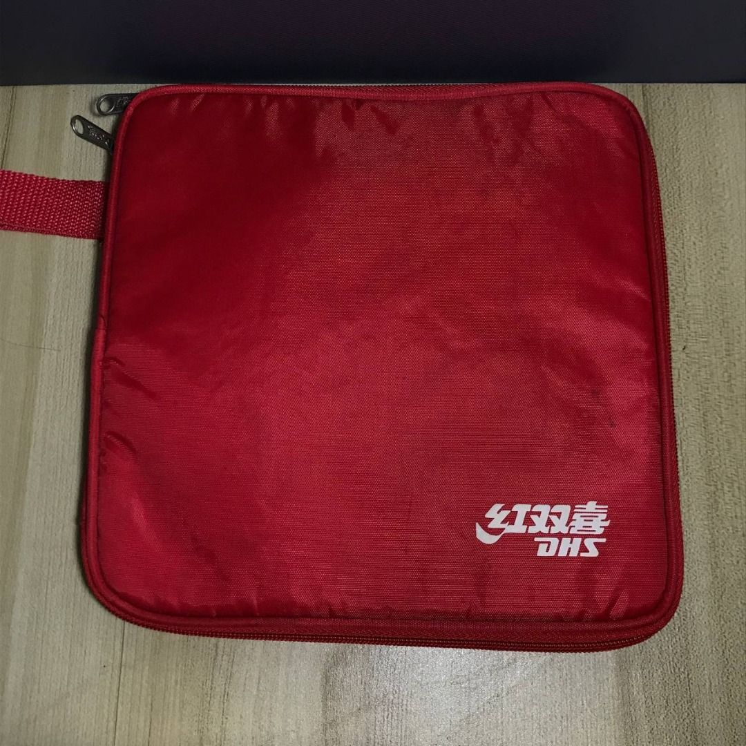 [ DHS ] Table Tennis Case (Category: Exercise Mats) located in Quezon City. Submitted by fortecant (Listing ID 1463402423, Image 1). Description: DHS Table Tennis Case [ DHS ] Table Tennis Case | Compact DHS table tennis blade case designed to hold one blade, perfect for keeping your racket protected and organized. ™️ Brand: DHS ☁️ Material: Not specified 📐 Dimes: L9 × W9 [ fits one blade ] OSFA 💰 Price: ₱800 ✨ Excellent Condition ✨ ˜”°• 𝓝𝓸𝓽