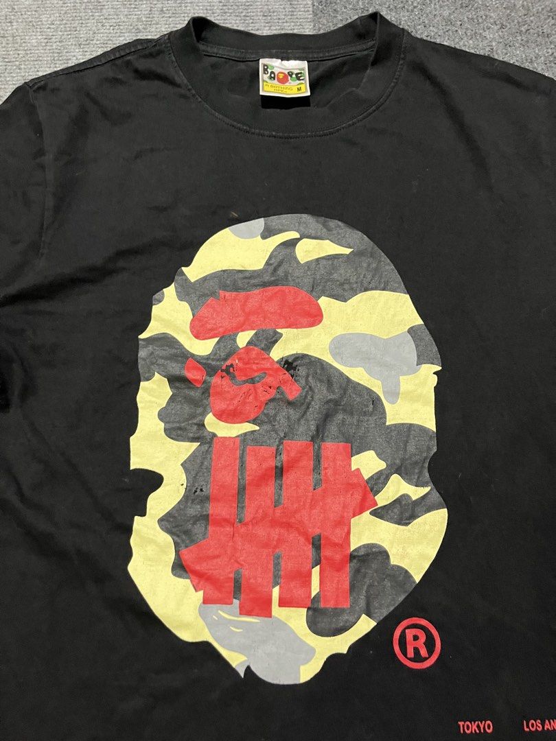 A Bathing Aape x Undefeated shirt off (Category: Tshirts & Polo Shirts ) located in Naga. Submitted by kots_rojan (Listing ID 1463480183, Image 2). Description: in excellent condition size M issue off complete tags color color color rate 9/10.