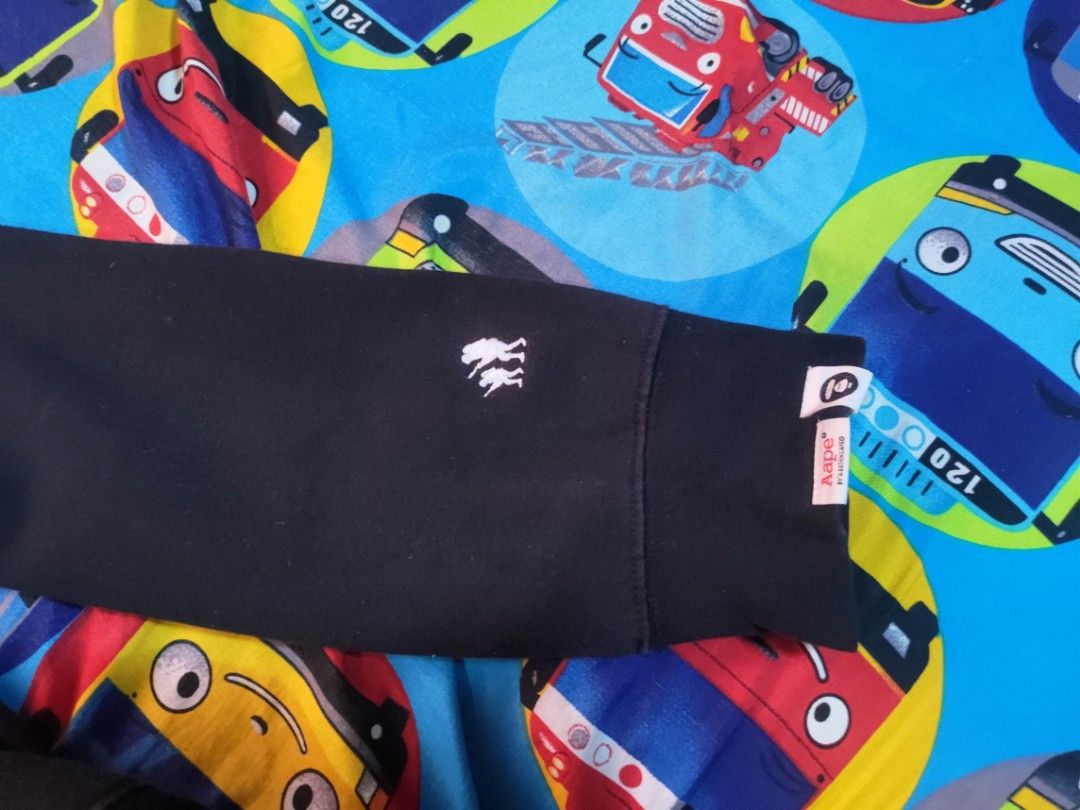 A Bathing Ape (BAPE) Black Hoodie (Category: Coats, Jackets and Outerwear) located in Quezon City. Submitted by christianpabalinas01_phoenix (Listing ID 1463364627, Image 1). Description: Authentic Black BAPE Hoodie (XL). Features iconic BAPE logo on back and sleeve, embroidered ape head on chest. Drawstrings and hood lining also branded. Comfortable cotton-poly blend. dimes sleeve-23.5inch width-21inch length-25inch issue have stain on hoodie de