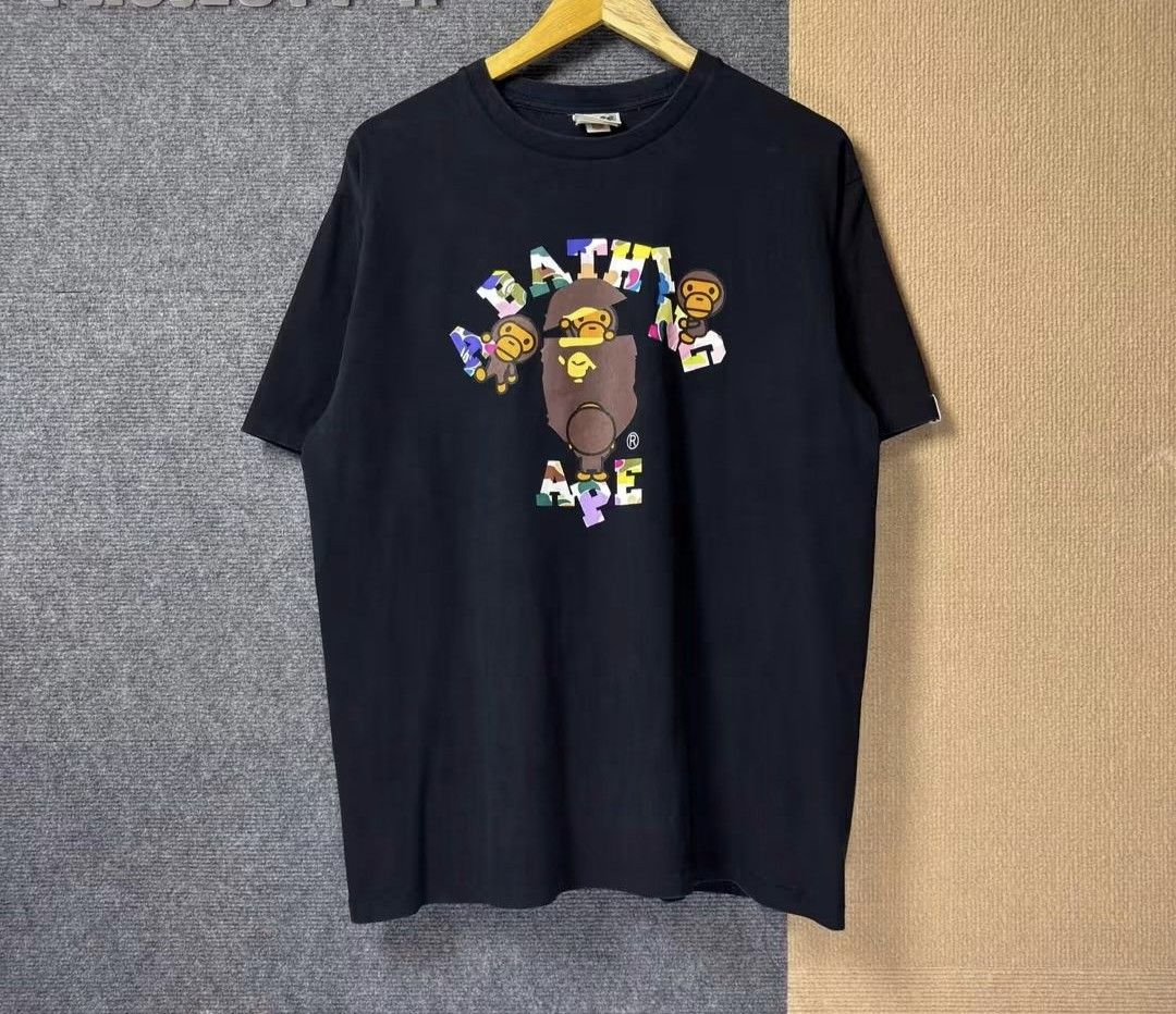 A Bathing Ape BAPE Tee XL (Category: Tshirts & Polo Shirts ) located in Manila. Submitted by leandroabi09471 (Listing ID 1463355977, Image 1). Description: - Authentic A Bathing Ape (BAPE) T-shirt - Color: Black - Size: XL - Features a colorful, eye-catching ape graphic - Ideal for streetwear fashion lovers - Don't miss the intricate details on the graphic!.