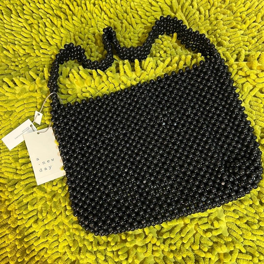 A New Day Black Beaded Shoulder Bag (Category: Shoulder Bags) located in Mangaldan. Submitted by ice_thrift_hub (Listing ID 1463424300, Image 1). Description: - Cute black beaded shoulder bag from A New Day. - Perfect for going out or adding flair to your outfit. - Beads are all intact and the bag has a nice shape. - Ideal size for carrying your essentials. - Comes with original tags attached..