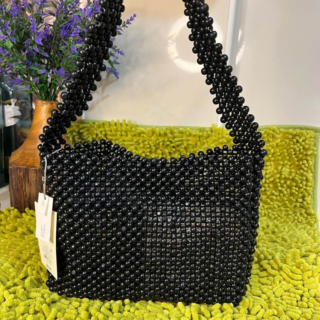 A New Day Black Beaded Shoulder Bag (Category: Shoulder Bags) located in Mangaldan. Submitted by ice_thrift_hub (Listing ID 1463424300, Image 2). Description: - Cute black beaded shoulder bag from A New Day. - Perfect for going out or adding flair to your outfit. - Beads are all intact and the bag has a nice shape. - Ideal size for carrying your essentials. - Comes with original tags attached..