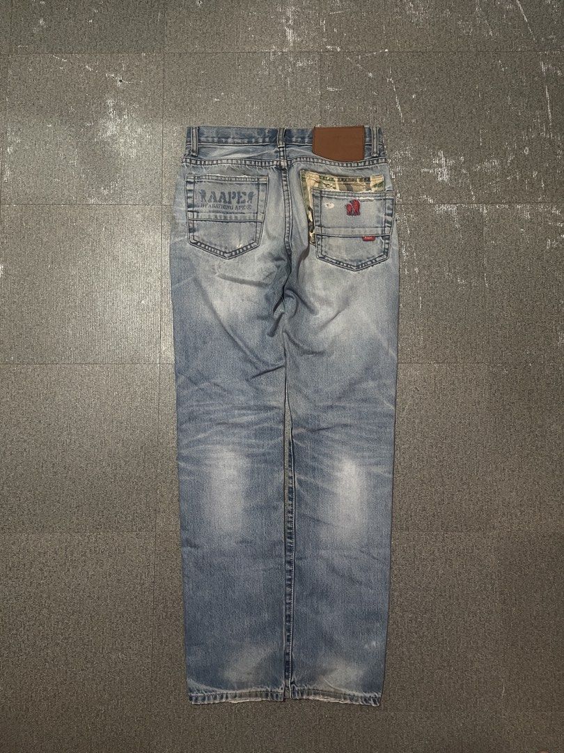AAPE BY A BATHING APE® Jeans (Category: Jeans) located in Manila. Submitted by saintino0222 (Listing ID 1463333349, Image 1). Description: - Light wash denim jeans from AAPE BY A BATHING APE® - Signature ape head logo on coin pocket - Embroidered details on back pockets - Distressing and fading throughout for a worn-in look - Red and blue stripe detail with AAPE branding on cuffs.