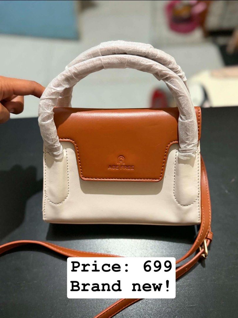 ACE FREE Two-Tone Top Handle Bag (Category: Tote Bags) located in Caloocan City. Submitted by rohllee (Listing ID 1463551871, Image 1). Description: - Stylish two-tone design (brown & off-white) - Versatile carrying options: top handle or detachable shoulder strap - Elegant gold hardware accents - Convenient interior pocket - Comes with a protective dust bag - Ideal for daily use.
