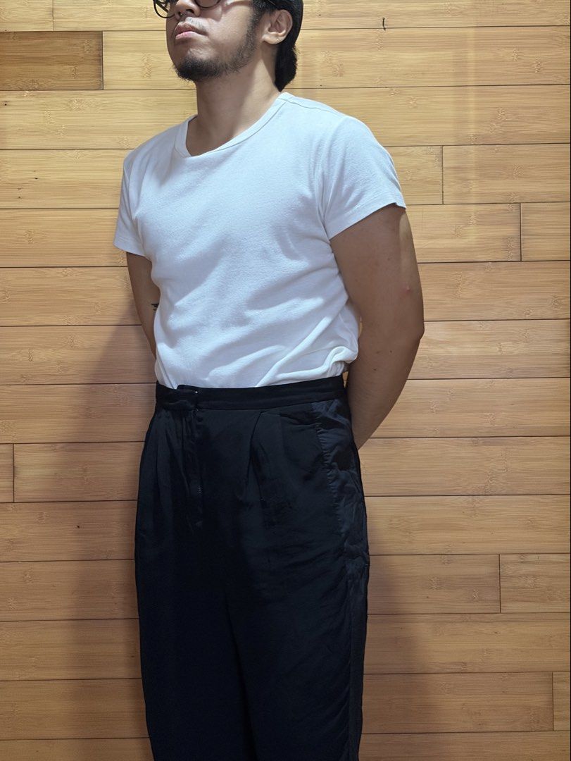 Acne Black High-Waisted Pleated Pants (Category: Other Bottoms) located in Las Pinas. Submitted by cmrqz (Listing ID 1463373343, Image 2). Description: - Minor tear at lower part (can be stitched ) - High-waisted black pants - Pleated front detail .
