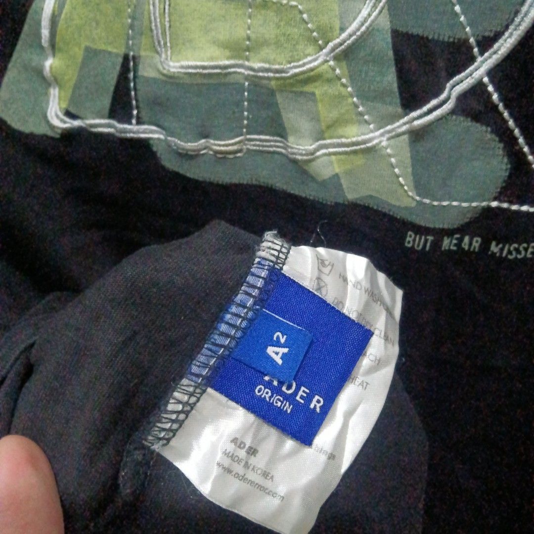 ADER ERROR Distorted Logo Shirt (Category: Tshirts & Polo Shirts ) located in Caloocan City. Submitted by jaychingsss (Listing ID 1463488738, Image 2). Description: Ader Error Distorted Logo Shirt - 100 21x28 Color Rate: 9/10 Complete Tags NEED WASH.