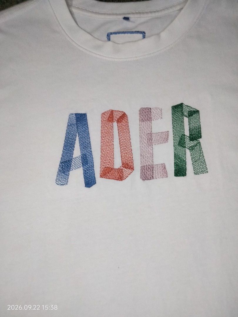 ADER Error White Embroidered Logo (Category: Tshirts & Polo Shirts ) located in Caloocan City. Submitted by haruconcep52476 (Listing ID 1463447889, Image 2). Description: Dimensions W21×L27 Good condition Color rate 9 No issue Need wash - White ADER Error T-shirt - Season: 2020 Spring Summer - Signature multi-color embroidered logo on front - Small ADER logo patch on back near hem - Made from good quality cotton - Simple and stylish design.