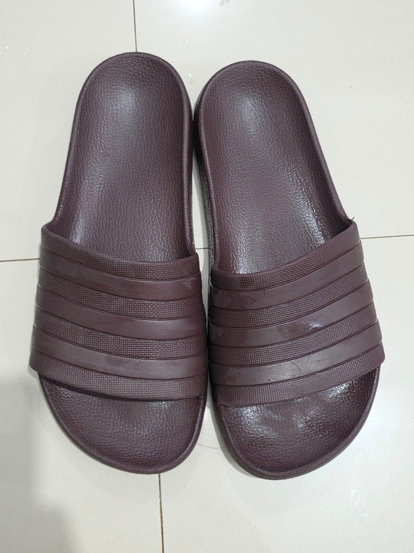 Adidas Adilette A50 Slides Maroon (Category: Slippers and slides) located in Manila. Submitted by shieladmd (Listing ID 1463433253, Image 2). Description: - Classic maroon Adidas Adilette A50 slides - Features the iconic three-stripe design - Deep maroon/burgundy color - Comfortable and easy to wear - Perfect for casual outings or post-workout recovery - Adidas logo embossed on the strap.