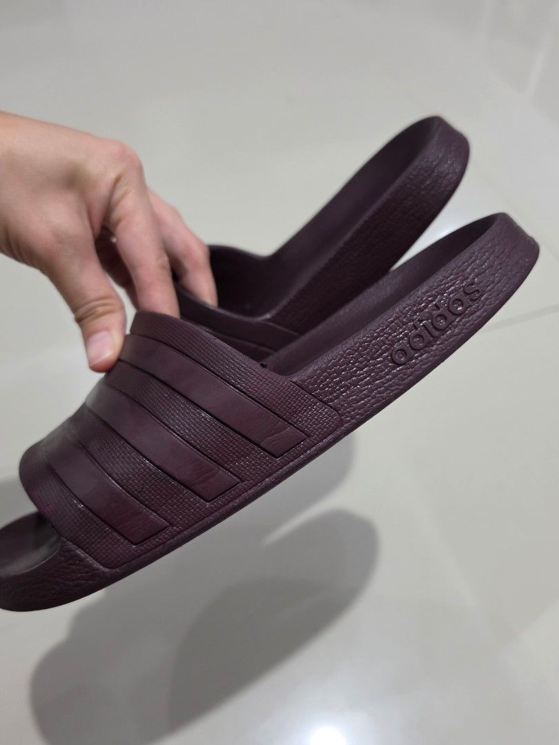 Adidas Adilette A50 Slides Maroon (Category: Slippers and slides) located in Manila. Submitted by shieladmd (Listing ID 1463433253, Image 3). Description: - Classic maroon Adidas Adilette A50 slides - Features the iconic three-stripe design - Deep maroon/burgundy color - Comfortable and easy to wear - Perfect for casual outings or post-workout recovery - Adidas logo embossed on the strap.