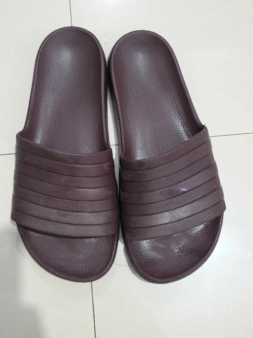 Adidas Adilette A50 Slides Maroon (Category: Slippers and slides) located in Manila. Submitted by shieladmd (Listing ID 1463433253, Image 1). Description: - Classic maroon Adidas Adilette A50 slides - Features the iconic three-stripe design - Deep maroon/burgundy color - Comfortable and easy to wear - Perfect for casual outings or post-workout recovery - Adidas logo embossed on the strap.