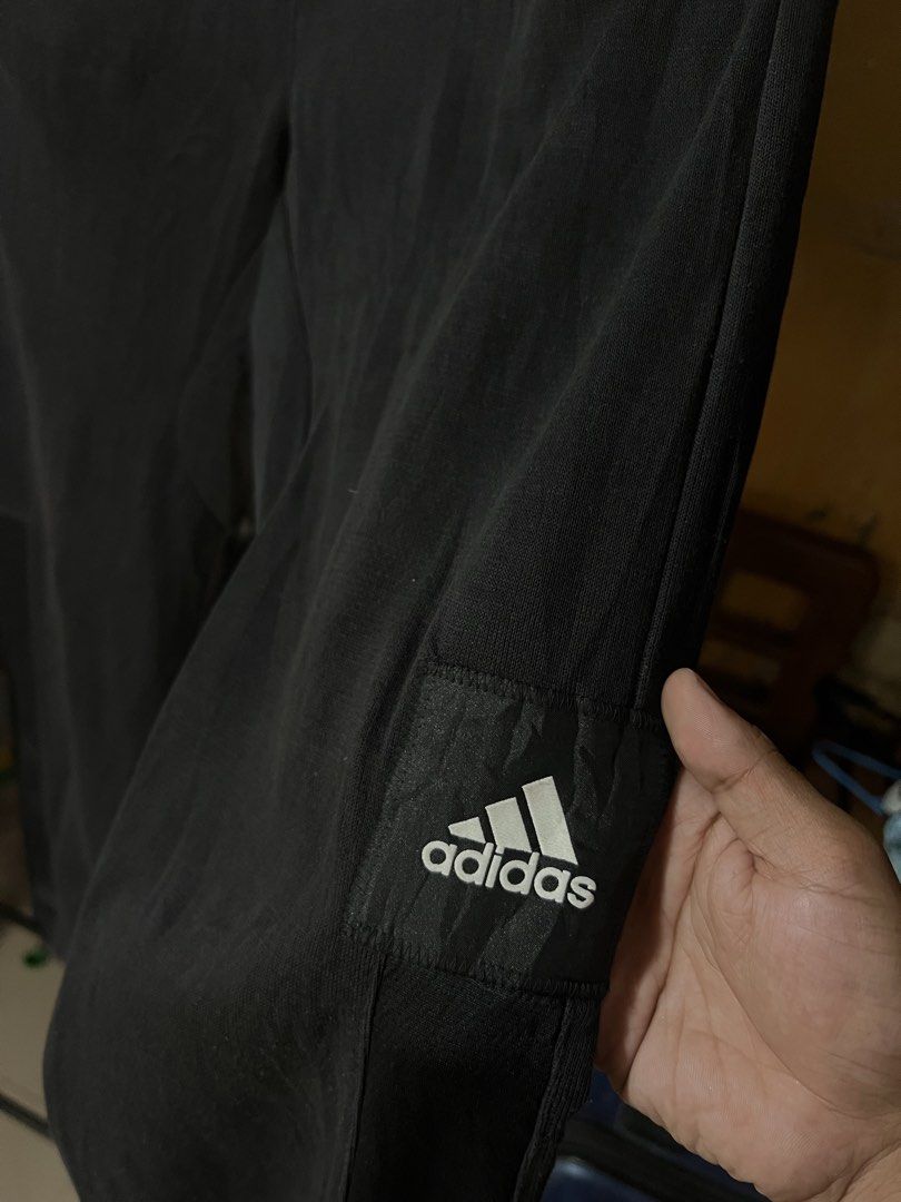 Adidas Black Jogger Pants (Category: Joggers) located in Butuan. Submitted by nikthrift. (Listing ID 1463334262, Image 2). Description: - Classic black Adidas jogger pants - Features the iconic Adidas logo on the side - Adjustable drawstring waist for a personalized, comfortable fit - Two convenient side pockets - Versatile for everyday casual wear or athletic activities.