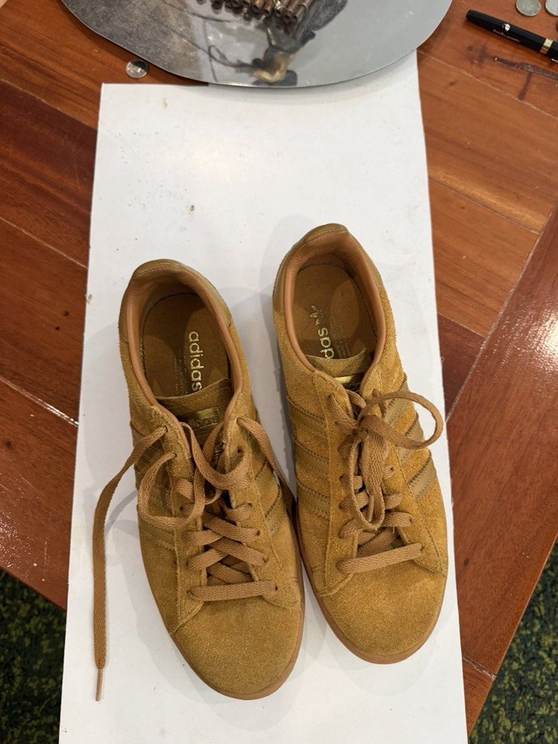 Adidas Campus Suede Sneakers Brown (Category: Casual Shoes) located in Manila. Submitted by domsyy (Listing ID 1463438224, Image 1). Description: - Classic Adidas Campus sneakers - Rich brown suede material - Iconic gold Adidas logo on heel and tongue - Secure lace-up closure - Durable gum sole - Ideal for casual and everyday wear.