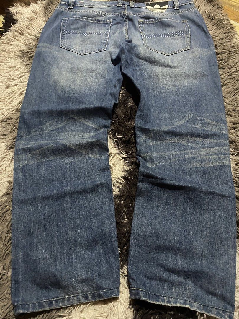 Adidas Denim Jeans (Category: Jeans) located in Caloocan City. Submitted by remythrift (Listing ID 1463496457, Image 2). Description: - Adidas blue wash denim jeans - Button fly closure - Distressed details on the front - Two back pockets with signature stitching - Classic Adidas branding on the coin pocket - Ideal for everyday casual wear.