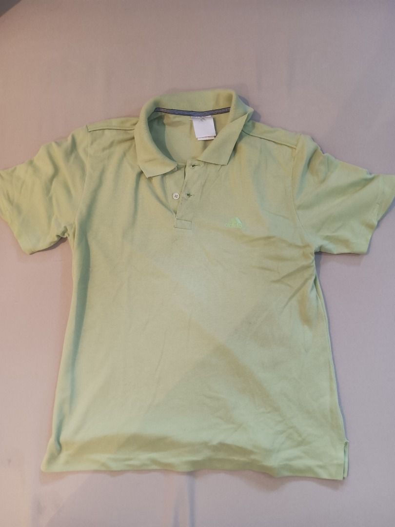 Adidas Light Green Polo Shirt (Category: Tshirts & Polo Shirts ) located in Muntinlupa City. Submitted by irene.aragon.navarro (Listing ID 1463353804, Image 1). Description: - Light green Adidas polo shirt - Short sleeves with collar - Two-button placket at the neck - Small Adidas logo embroidered on the chest - Perfect for casual outings or sports activities.