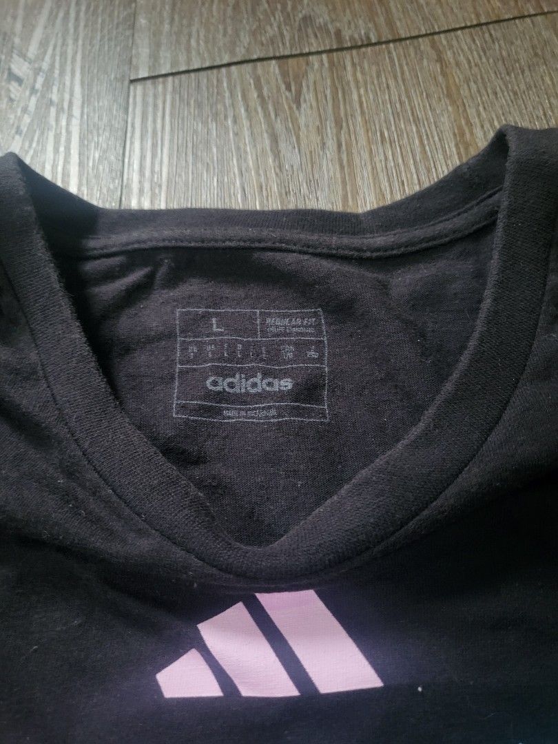 ADIDAS Messi Inter Miami Shirt (Category: Tshirts & Polo Shirts ) located in Quezon City. Submitted by w_shawnyyy (Listing ID 1463384340, Image 2). Description: ADIDAS Inter Miami Messi Shirt - Black with Printed - No issues, good condition - Not Thrifted, personal clothes Length- 29.5in Chest- 22in Location: Near SM Fairview Shipping: Lalamove, Jnt (buyer shoulders sf).