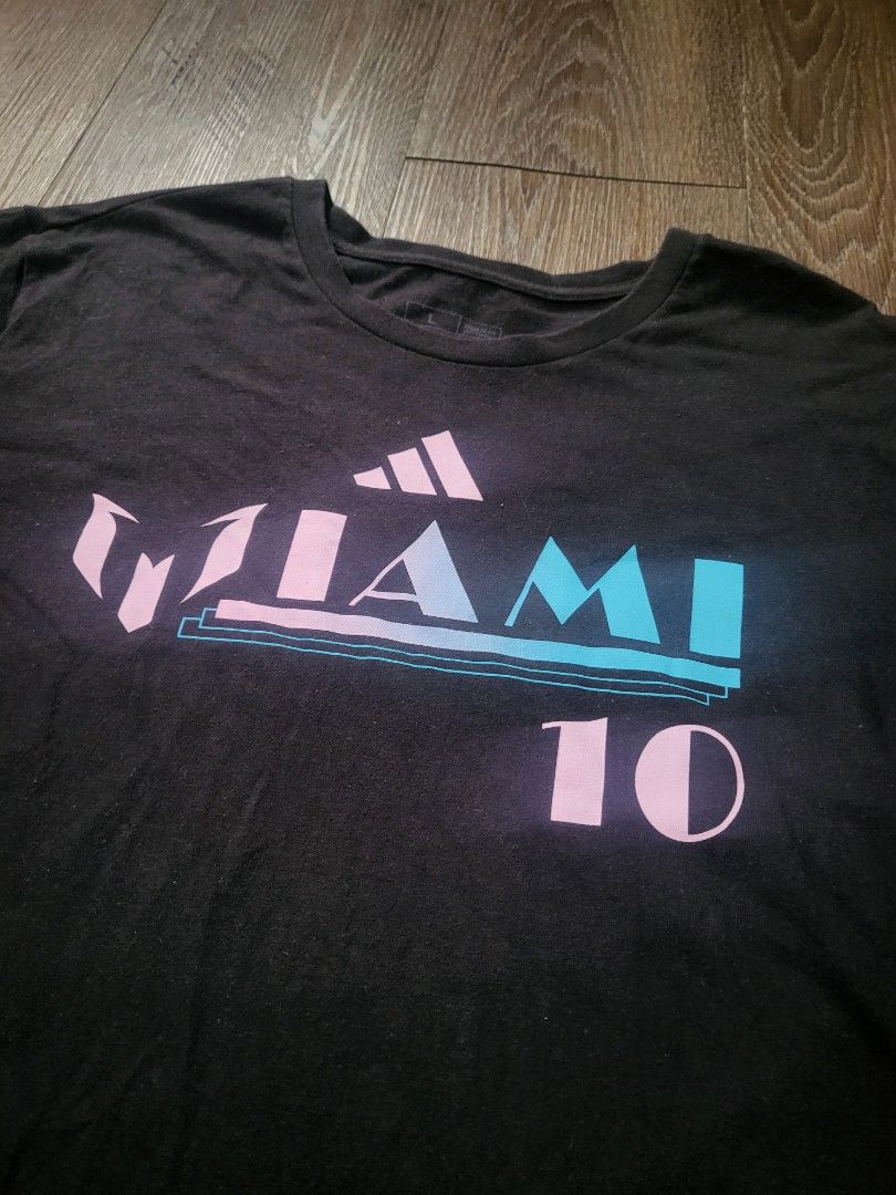 ADIDAS Messi Inter Miami Shirt (Category: Tshirts & Polo Shirts ) located in Quezon City. Submitted by w_shawnyyy (Listing ID 1463384340, Image 3). Description: ADIDAS Inter Miami Messi Shirt - Black with Printed - No issues, good condition - Not Thrifted, personal clothes Length- 29.5in Chest- 22in Location: Near SM Fairview Shipping: Lalamove, Jnt (buyer shoulders sf).