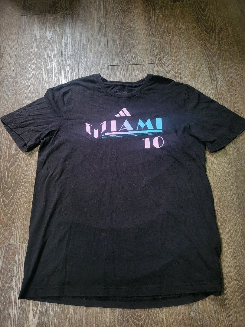 ADIDAS Messi Inter Miami Shirt (Category: Tshirts & Polo Shirts ) located in Quezon City. Submitted by w_shawnyyy (Listing ID 1463384340, Image 1). Description: ADIDAS Inter Miami Messi Shirt - Black with Printed - No issues, good condition - Not Thrifted, personal clothes Length- 29.5in Chest- 22in Location: Near SM Fairview Shipping: Lalamove, Jnt (buyer shoulders sf).