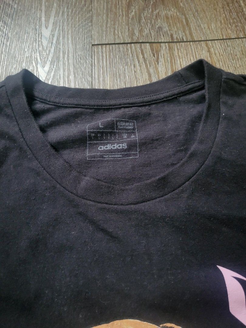 ADIDAS Messi Shirt (Category: Tshirts & Polo Shirts ) located in Quezon City. Submitted by w_shawnyyy (Listing ID 1463383909, Image 2). Description: ADIDAS Messi Shirt - Black with Printed - Authentic - No issues, good condition - Not Thrifted, personal clothes Length- 29.5in Chest- 22in Location: Near SM Fairview Shipping: Lalamove, Jnt (buyer shoulders sf) .