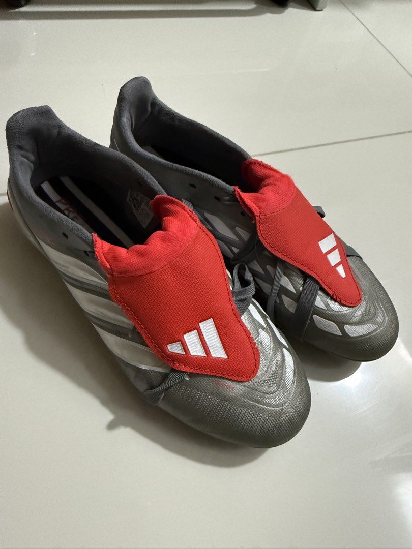 Adidas Predator Football Boots (Category: Racket and Ball Sports) located in Taguig. Submitted by sandz392 (Listing ID 1463459846, Image 1). Description: Adidas Predator football boots (grey/red). Firm ground cleats. Lace-up. Game ready!.