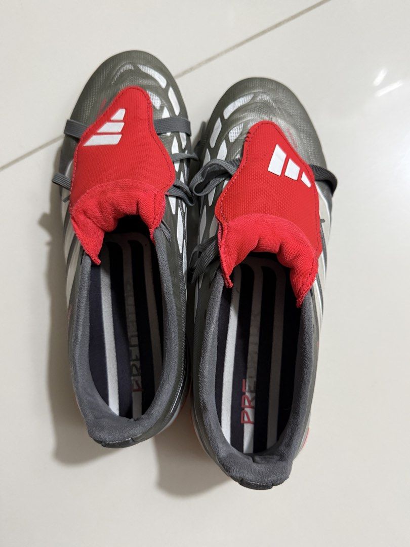 Adidas Predator Football Boots (Category: Racket and Ball Sports) located in Taguig. Submitted by sandz392 (Listing ID 1463459846, Image 2). Description: Adidas Predator football boots (grey/red). Firm ground cleats. Lace-up. Game ready!.