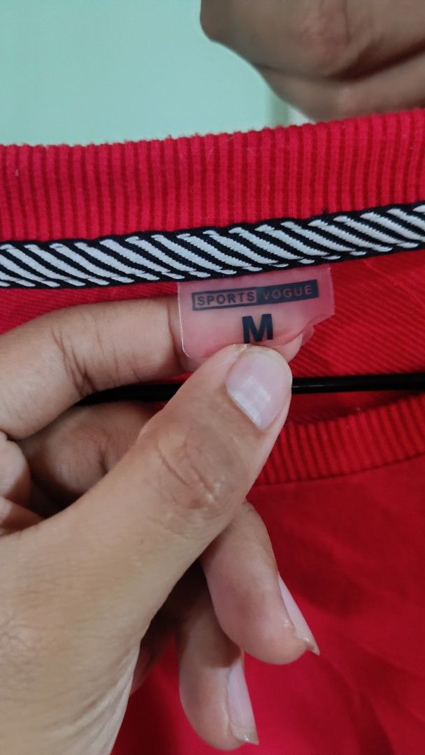 Adidas Red Crewneck Sweatshirt Size M (Category: Coats, Jackets and Outerwear) located in Taguig. Submitted by redarmy21775000 (Listing ID 1463344645, Image 3). Description: - Classic Adidas sweatshirt in size M. - Features the iconic Adidas logo on the chest. - Stylish dark grey panels on shoulders and sleeves. - Comfortable ribbed cuffs and hem. - Made from a soft cotton blend..