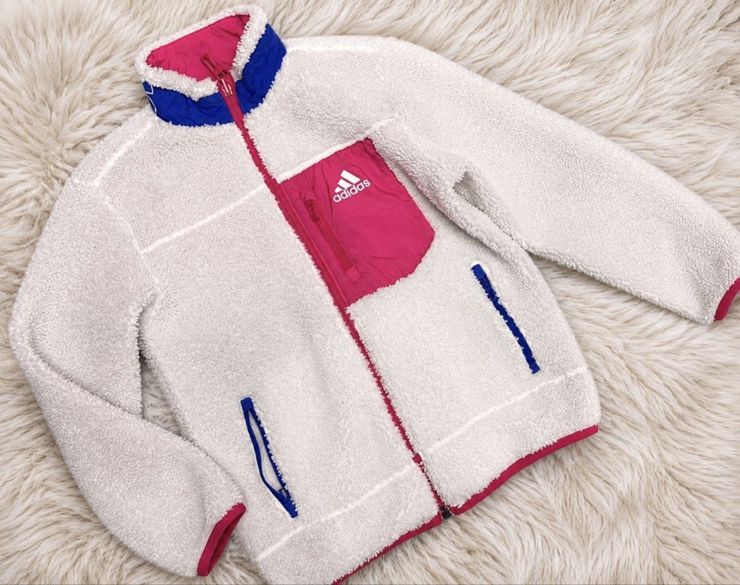 Adidas Reversible Fleece Jacket Pink Blue (Category: Coats, Jackets and Outerwear) located in Manila. Submitted by goldencrystal.1726fa (Listing ID 1463456357, Image 3). Description: - Super cute Adidas jacket for 8-9 years old - Reversible design: Pink with blue pockets on one side, cream fleece with pink/blue accents on the other - Adidas logo featured on both sides - Ideal for staying warm and stylish -may mga fibers lang dumikit sa sherpa par